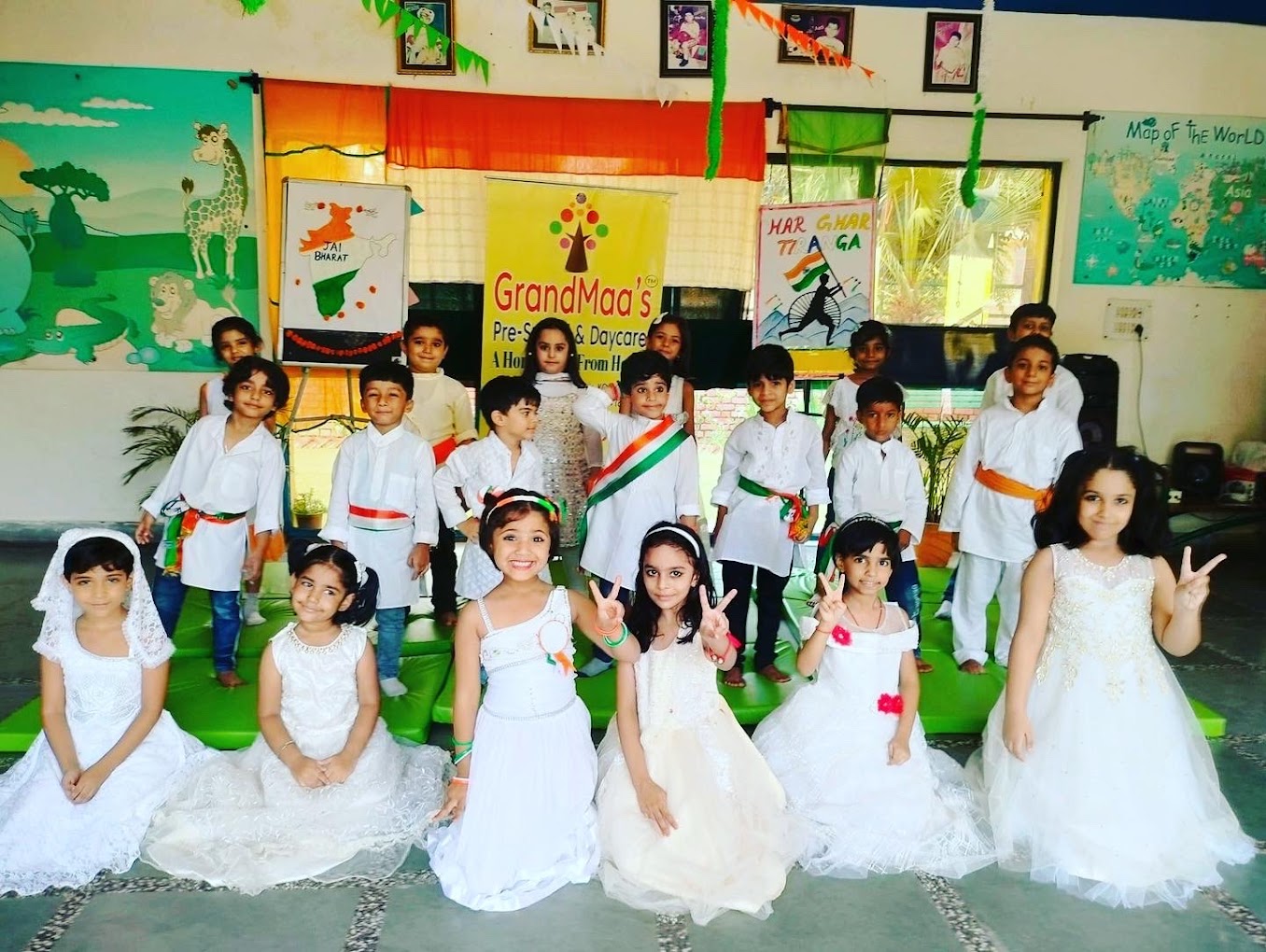 Children on stage in traditional costumes with trophies at Grandmaa's Preschool & DayCare, Greater Noida