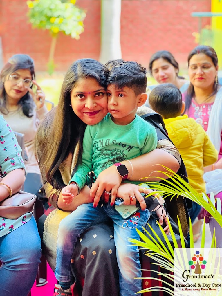 Teacher and child sharing a warm moment outdoors at Grandmaa's Preschool & DayCare, Greater Noida