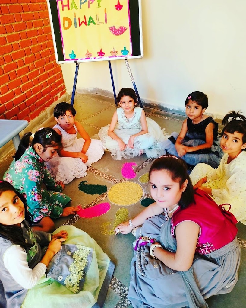 Children creating a Diwali rangoli together at Grandmaa's Preschool & DayCare, Greater Noida