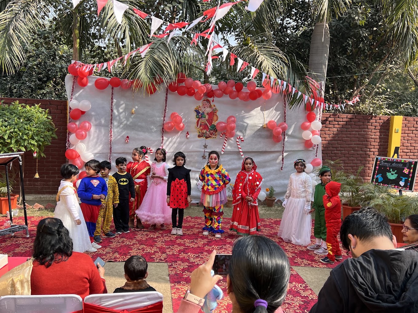 Children in costume at an outdoor fancy dress performance at Grandmaa's Preschool & DayCare, Greater Noida