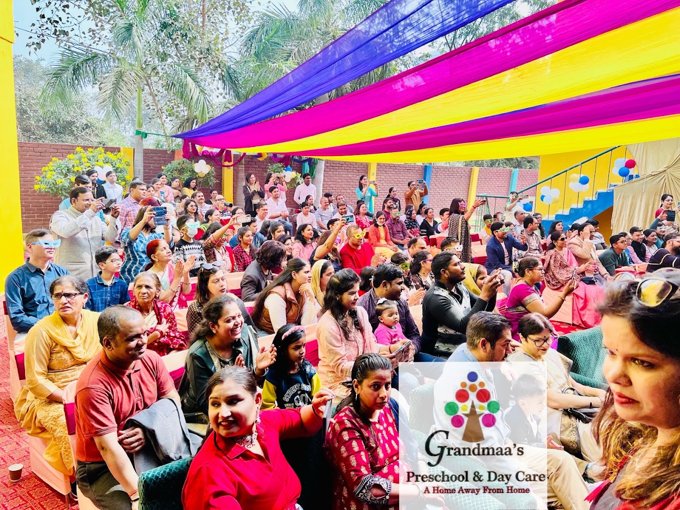 Parents and families at an outdoor school event at Grandmaa's Preschool & DayCare, Greater Noida