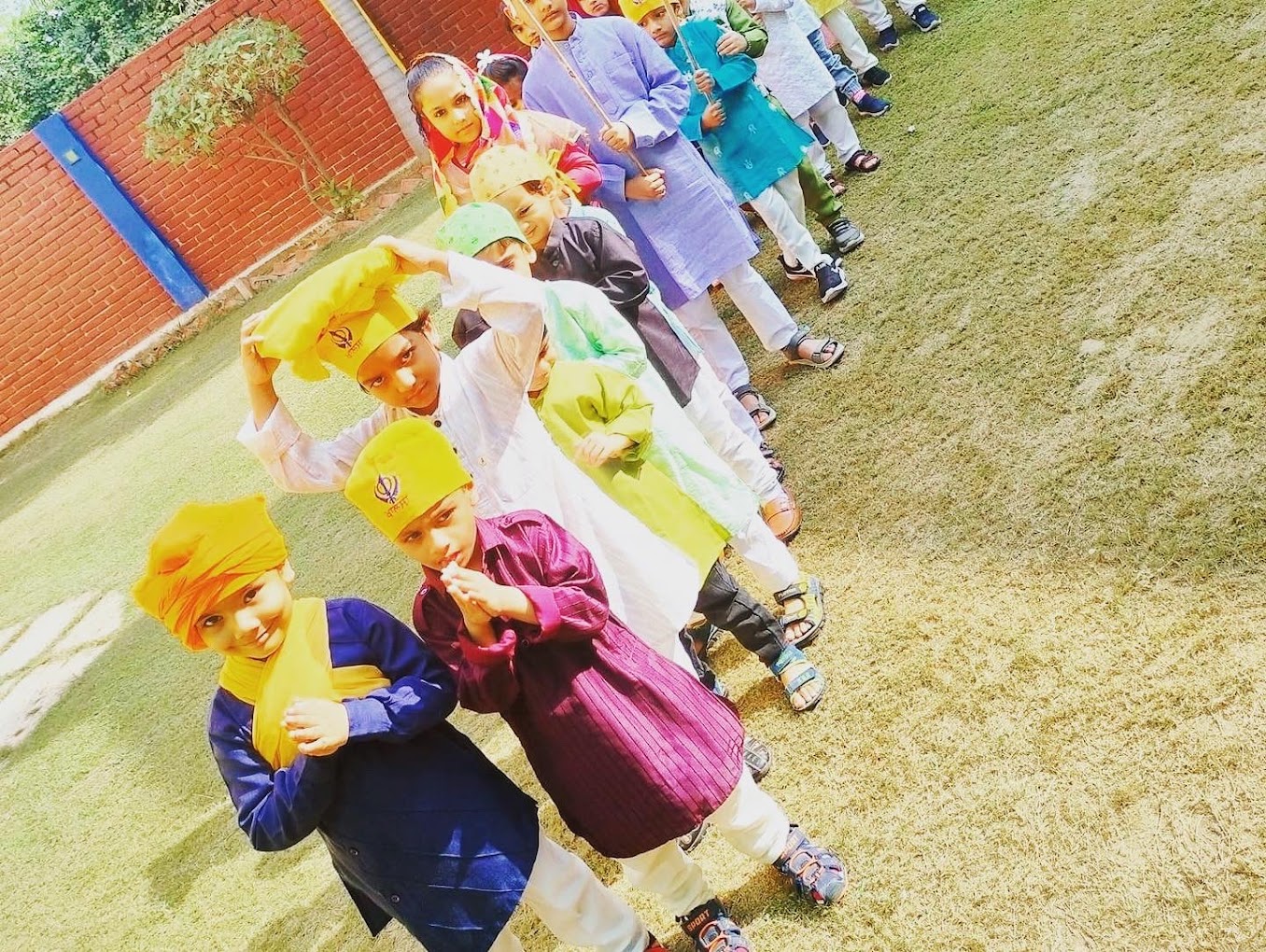 Children in traditional attire at an outdoor celebration at Grandmaa's Preschool & DayCare, Greater Noida