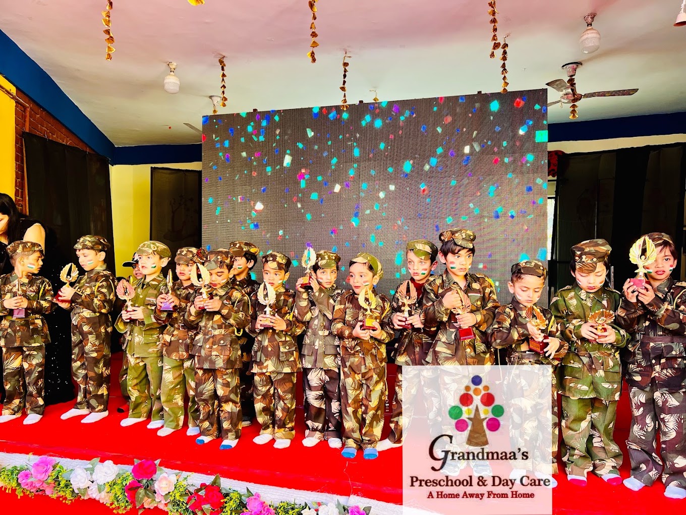 Children on stage with trophies at school event at Grandmaa's Preschool & DayCare, Greater Noida