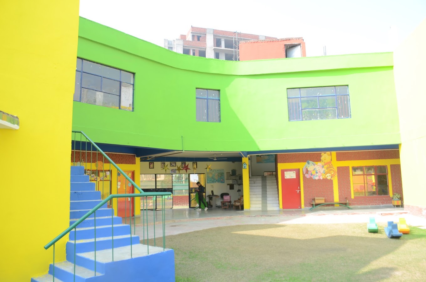 School building exterior with colourful play area at Grandmaa's Preschool & DayCare, Greater Noida