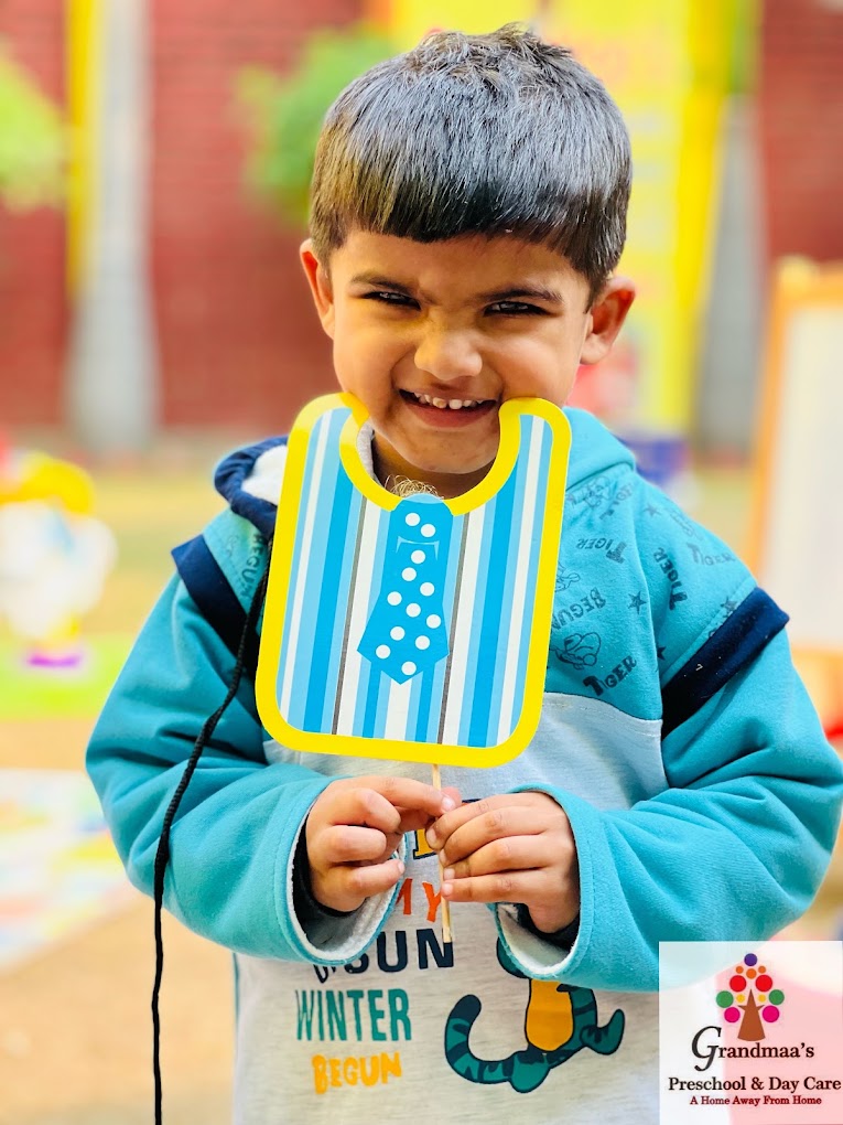 Child enjoying a creative photo activity at Grandmaa's Preschool & DayCare, Greater Noida